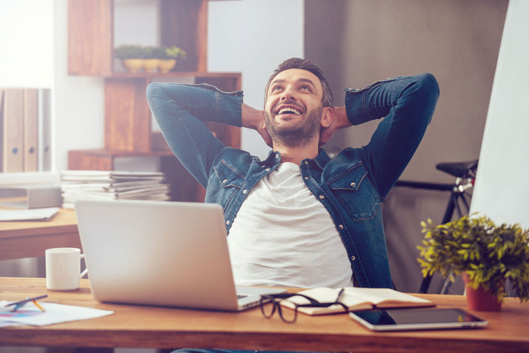 Happy man in office - Parker Russell